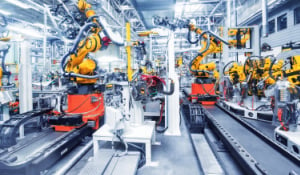 Manufacturing plant stock image with many machines producing materials autonomously